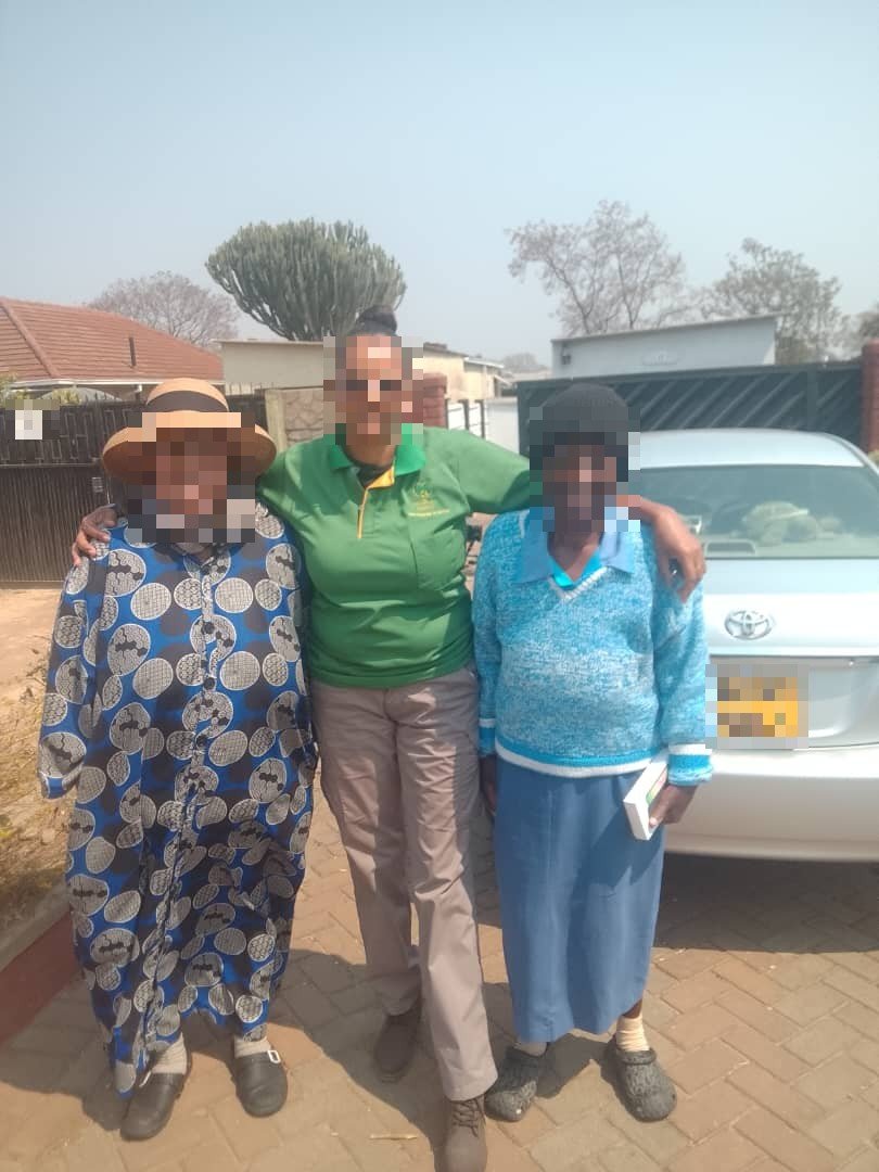 Diaspora Direct agent with two elderly clients during a welfare visit
